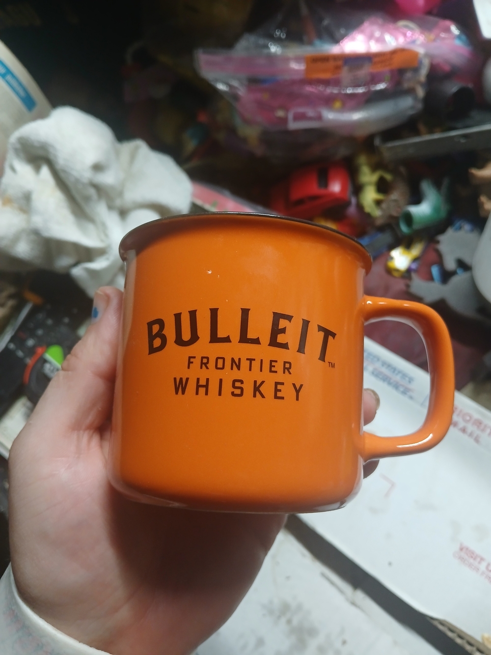 orange ceramic campfire-style coffee mug featuring the black and white Bulleit F